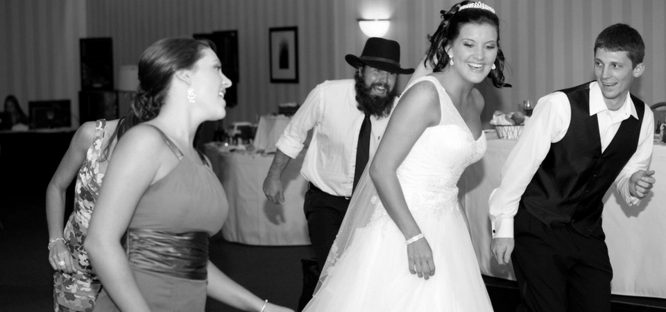 Bride with guests dancing to music